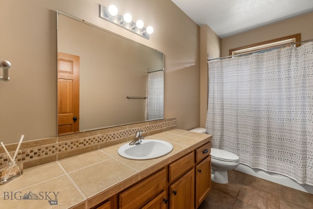 3300 E Graf Unit 26, Bozeman, MT 59715 - full bathroom featuring vanity, curtained shower, tile patterned floors, and tasteful backsplash