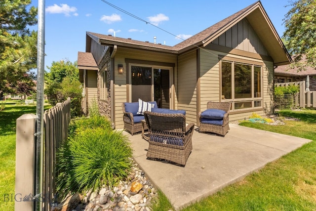 3300 E Graf Unit 26, Bozeman, MT 59715 - back of property with board and batten siding and a patio