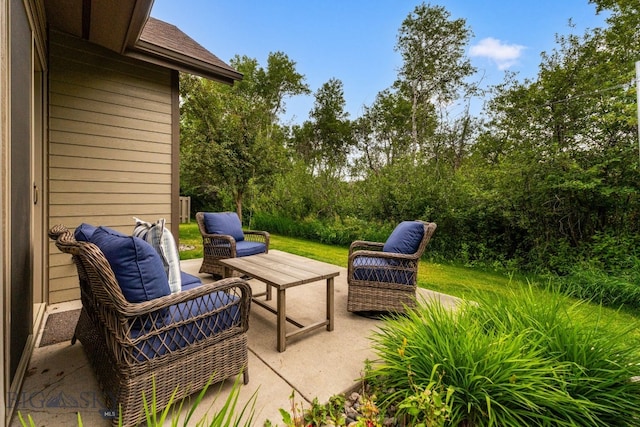 3300 E Graf Unit 26, Bozeman, MT 59715 - view of patio featuring an outdoor hangout area and view of wooded area