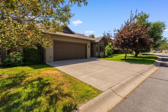 3300 E Graf Unit 26, Bozeman, MT 59715 - view of front facade with a front lawn, a garage, and concrete driveway