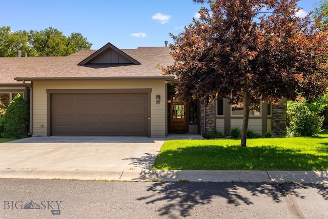3300 E Graf Unit 26, Bozeman, MT 59715 - view of front of house with an attached garage, concrete driveway, a front yard, and a shingled roof