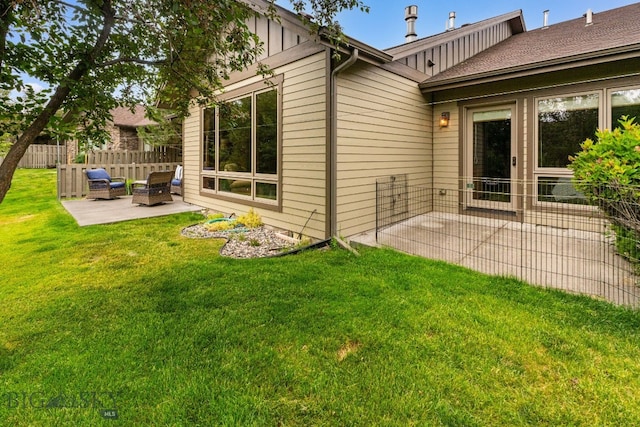 3300 E Graf Unit 26, Bozeman, MT 59715 - rear view of property with a patio and board and batten siding