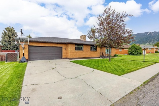 3011 Kossuth, Butte, MT 59701 - ranch-style home with brick siding, a garage, driveway, and a chimney
