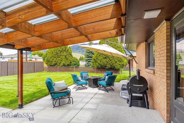 3011 Kossuth, Butte, MT 59701 - fenced backyard with an outdoor fire pit, a patio, and grilling area