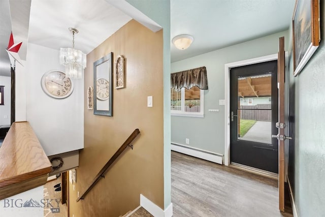 3011 Kossuth, Butte, MT 59701 - stairway with baseboard heating, wood finished floors, and a chandelier
