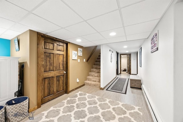 3011 Kossuth, Butte, MT 59701 - foyer with wood finished floors, a baseboard radiator, stairs, a paneled ceiling, and recessed lighting