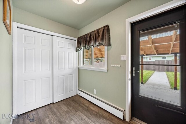3011 Kossuth, Butte, MT 59701 - entrance foyer featuring a baseboard radiator and dark wood-style floors
