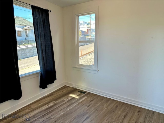 110 E Center St, Butte, MT 59701 - spare room with wood finished floors and baseboards