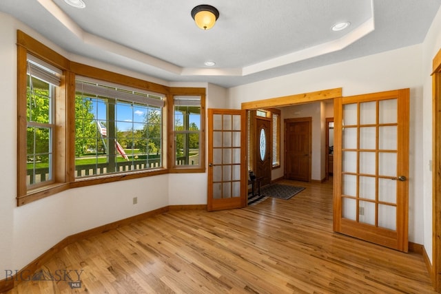 34 W Katina Ct, Bozeman, MT 59718 - entrance foyer with light wood finished floors, a tray ceiling, french doors, and recessed lighting
