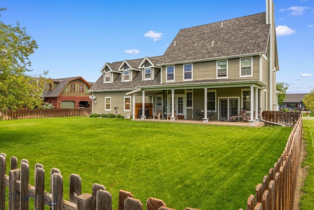 34 W Katina Ct, Bozeman, MT 59718 - rear view of property with a patio and a fenced backyard