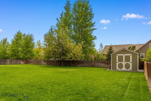 34 W Katina Ct, Bozeman, MT 59718 - fenced backyard with a storage unit