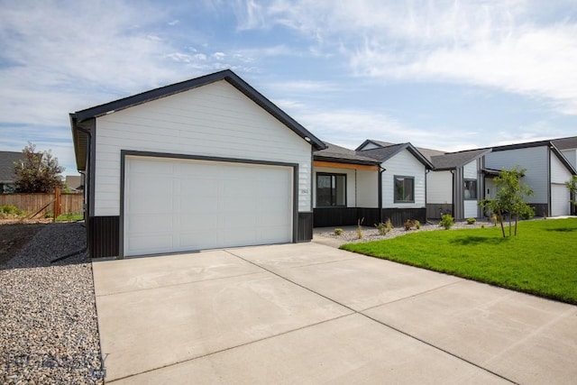 1511 Pistolero Way, Belgrade, MT 59714 - view of front of property with driveway and a garage