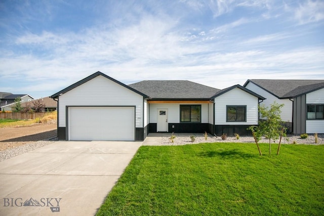 1511 Pistolero Way, Belgrade, MT 59714 - view of front facade with an attached garage and driveway