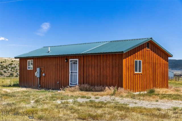 30 Hayfield Loop Trl, Ennis, MT 59729 - view of front of house with board and batten siding and a metal roof