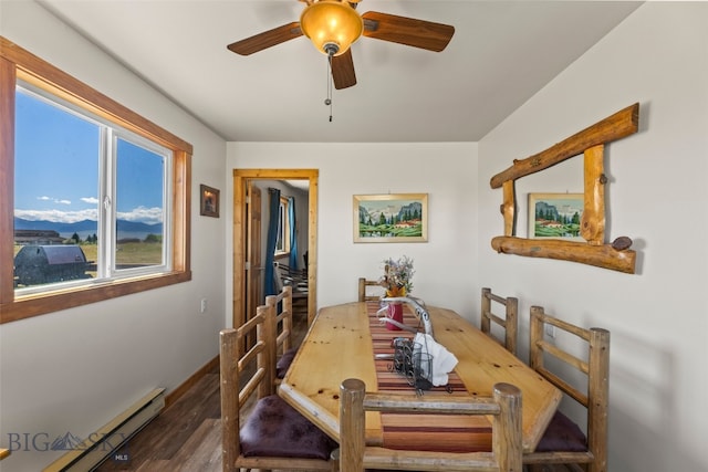 30 Hayfield Loop Trl, Ennis, MT 59729 - dining room featuring a baseboard radiator, wood finished floors, ceiling fan, a mountain view, and an office area
