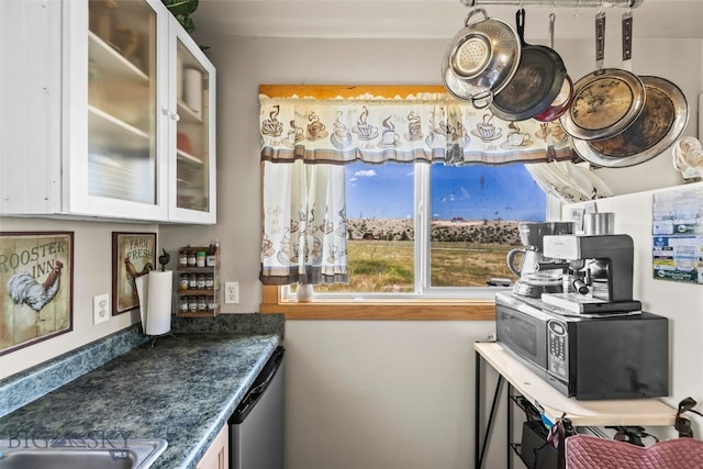 30 Hayfield Loop Trl, Ennis, MT 59729 - kitchen with white cabinetry, dishwasher, glass insert cabinets, and dark countertops