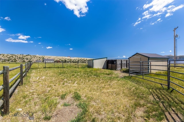 30 Hayfield Loop Trl, Ennis, MT 59729 - view of yard with an exterior structure, an outbuilding, and a rural view