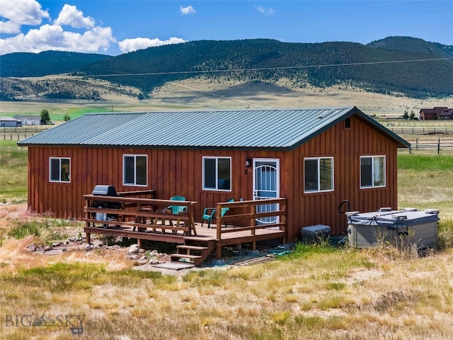 30 Hayfield Loop Trl, Ennis, MT 59729 - rear view of property with a metal roof, a deck with mountain view, and board and batten siding