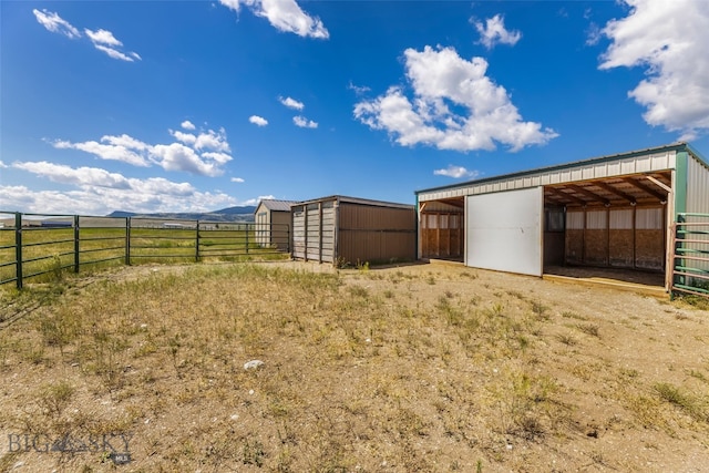 30 Hayfield Loop Trl, Ennis, MT 59729 - view of yard featuring an outbuilding and an exterior structure