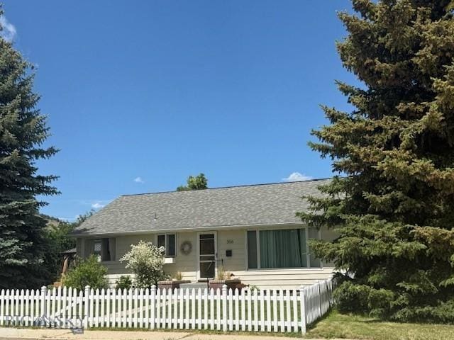 306 Juniper St, Anaconda, MT 59711 - view of front facade featuring a fenced front yard and roof with shingles