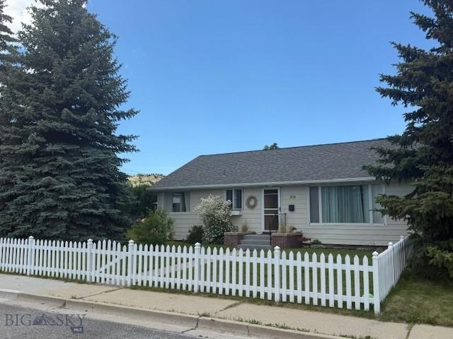 306 Juniper St, Anaconda, MT 59711 - ranch-style home featuring a fenced front yard