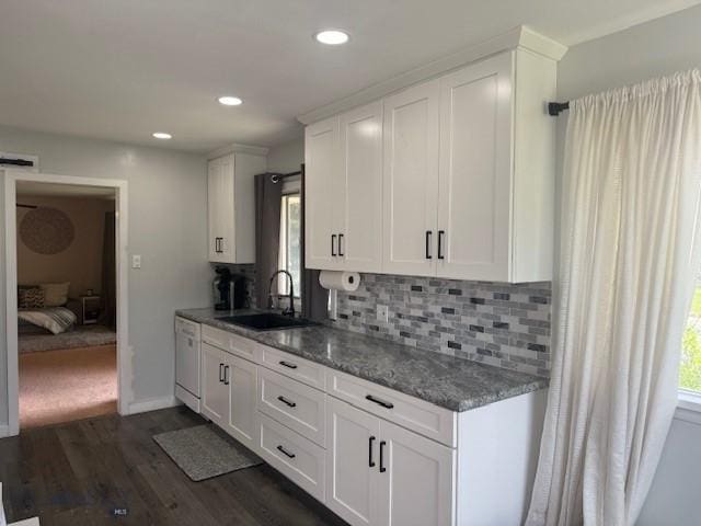 306 Juniper St, Anaconda, MT 59711 - kitchen with white cabinetry, dark wood-style flooring, tasteful backsplash, recessed lighting, and stone countertops