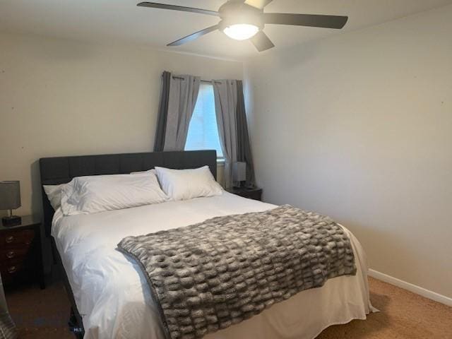306 Juniper St, Anaconda, MT 59711 - carpeted bedroom featuring baseboards and ceiling fan