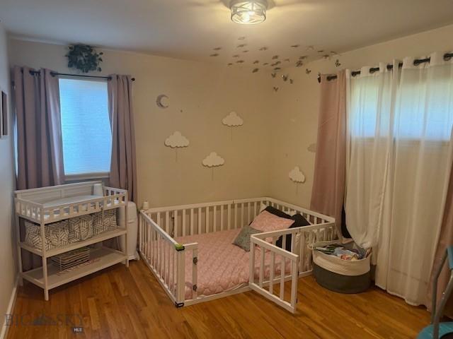 306 Juniper St, Anaconda, MT 59711 - bedroom featuring wood finished floors