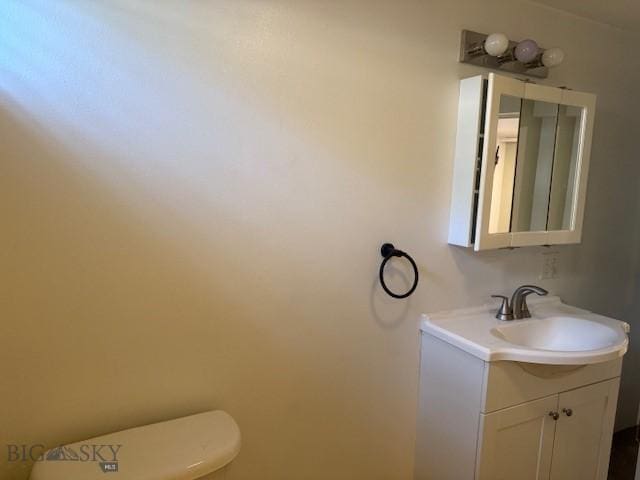 306 Juniper St, Anaconda, MT 59711 - bathroom featuring vanity and toilet
