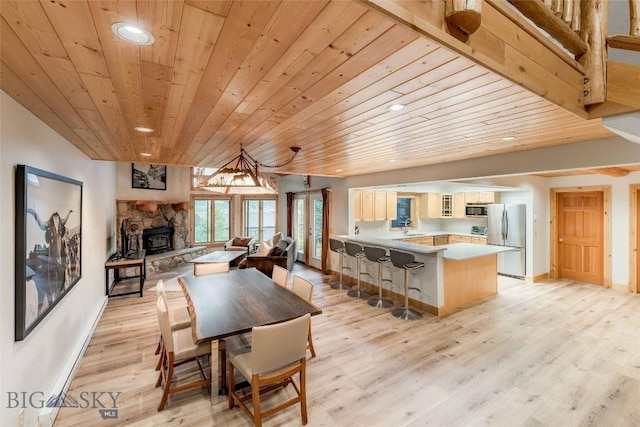 8 Ringneck Dr, Big Sky, MT 59716 - dining area featuring wooden ceiling, light wood finished floors, and recessed lighting
