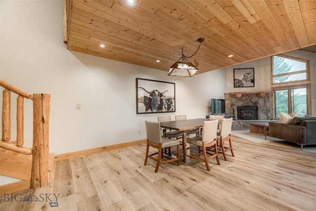 8 Ringneck Dr, Big Sky, MT 59716 - dining space featuring wooden ceiling, recessed lighting, light wood-style flooring, lofted ceiling, and a fireplace