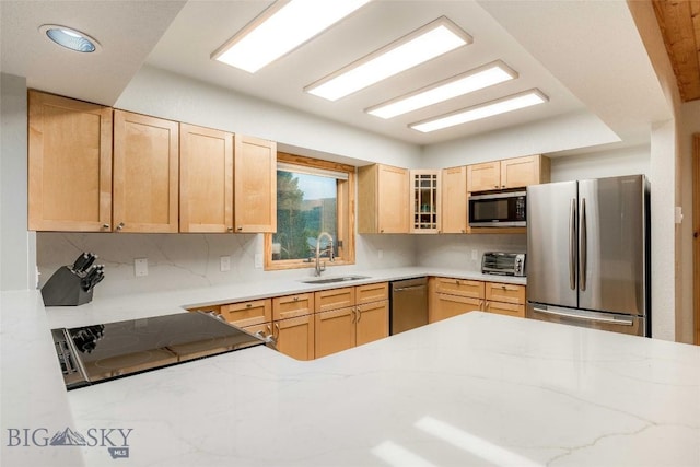 8 Ringneck Dr, Big Sky, MT 59716 - kitchen featuring appliances with stainless steel finishes, light brown cabinetry, glass insert cabinets, backsplash, and recessed lighting