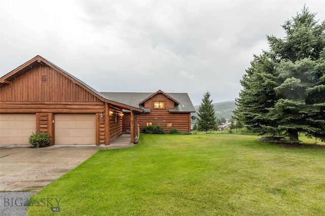 8 Ringneck Dr, Big Sky, MT 59716 - cabin with an attached garage, a front yard, concrete driveway, and roof with shingles