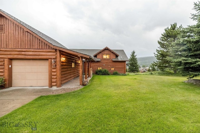 8 Ringneck Dr, Big Sky, MT 59716 - view of grassy yard featuring concrete driveway and a garage