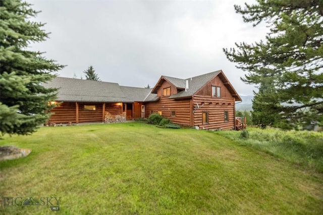 8 Ringneck Dr, Big Sky, MT 59716 - rear view of house with a yard
