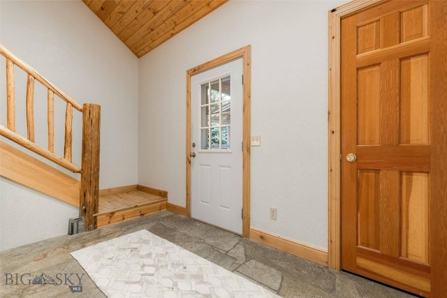 8 Ringneck Dr, Big Sky, MT 59716 - entrance foyer with wooden ceiling, vaulted ceiling, carpet flooring, and stairway