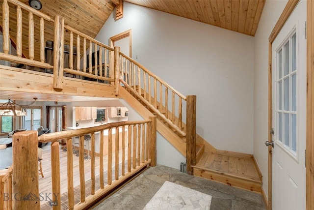 8 Ringneck Dr, Big Sky, MT 59716 - stairway with wooden ceiling, a chandelier, and vaulted ceiling