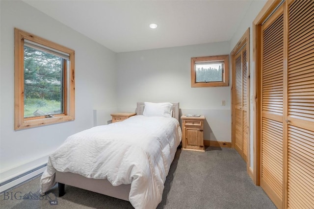 8 Ringneck Dr, Big Sky, MT 59716 - bedroom featuring baseboard heating, carpet flooring, multiple closets, and recessed lighting