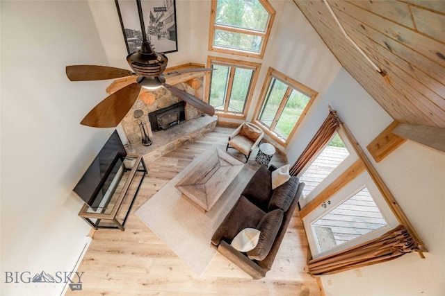 8 Ringneck Dr, Big Sky, MT 59716 - living area featuring wood finished floors, a high ceiling, and a ceiling fan