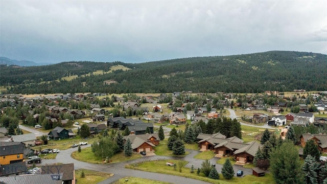 8 Ringneck Dr, Big Sky, MT 59716 - aerial view of property's location featuring nearby suburban area and a mountain backdrop