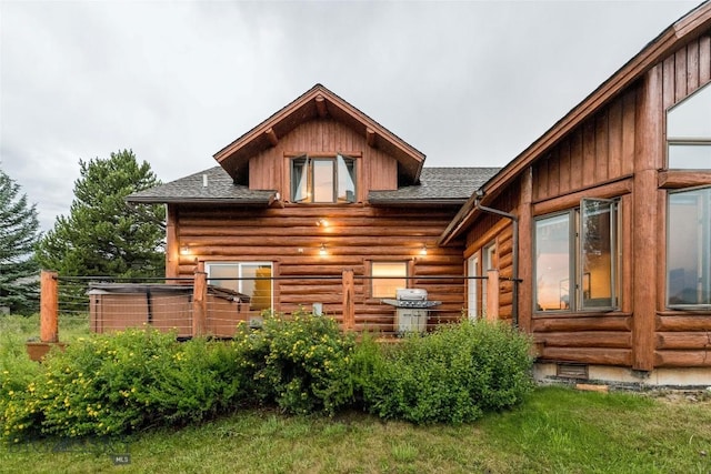 8 Ringneck Dr, Big Sky, MT 59716 - back of property featuring a shingled roof, log siding, and board and batten siding