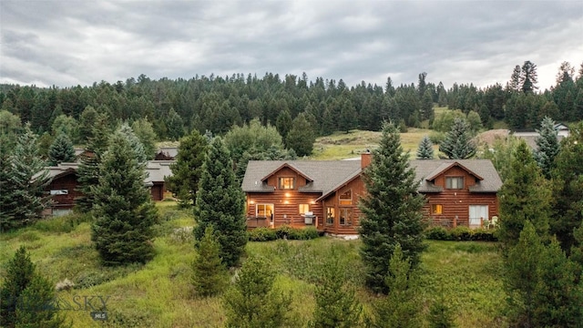 8 Ringneck Dr, Big Sky, MT 59716 - aerial view of property and surrounding area with a heavily wooded area
