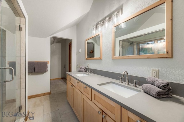 8 Ringneck Dr, Big Sky, MT 59716 - bathroom featuring double vanity, a stall shower, and lofted ceiling