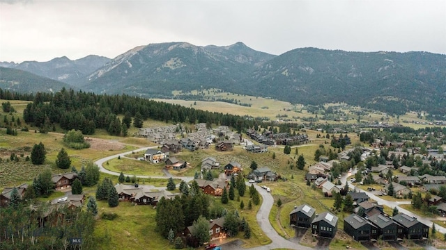 8 Ringneck Dr, Big Sky, MT 59716 - aerial view of property's location with a mountain backdrop and nearby suburban area