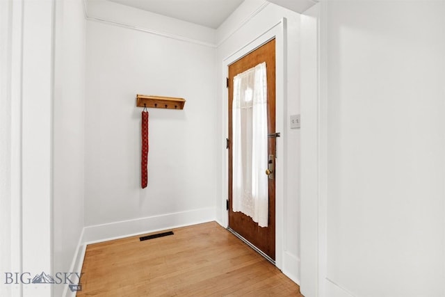 1039 Placer St, Butte, MT 59701 - entrance foyer with light wood-style flooring and baseboards