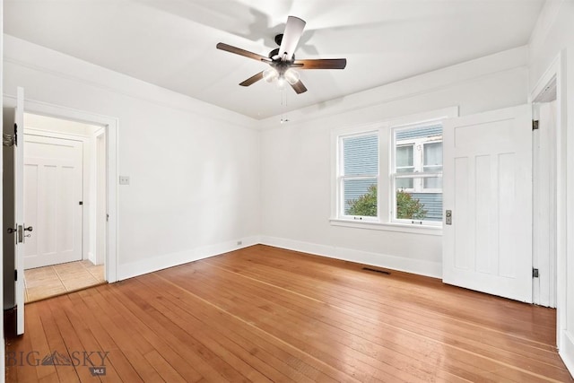 1039 Placer St, Butte, MT 59701 - unfurnished room with a ceiling fan and light wood-style floors