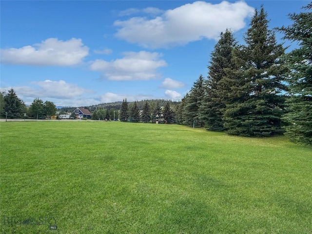 80 Aspen Leaf Dr Unit 7, Big Sky, MT 59716 - surrounding community featuring a yard and a forest view