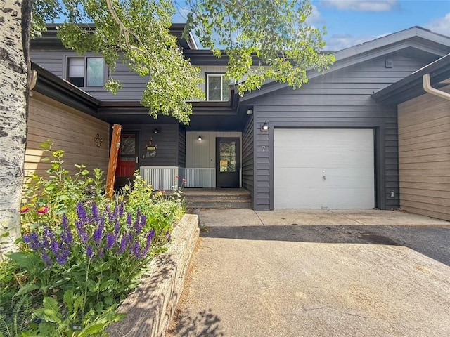 80 Aspen Leaf Dr Unit 7, Big Sky, MT 59716 - view of front facade featuring covered porch and driveway