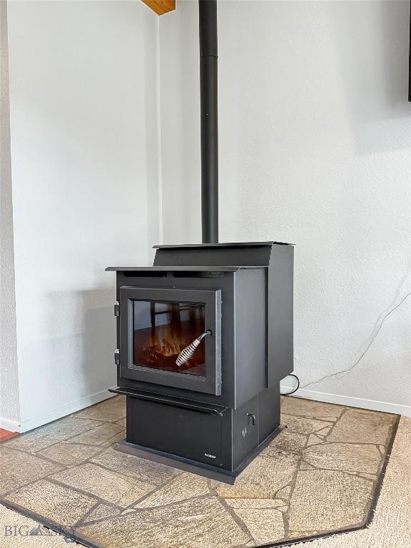 80 Aspen Leaf Dr Unit 7, Big Sky, MT 59716 - detailed view of a wood stove and baseboards