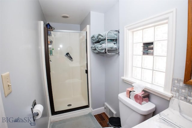 706 Locust St, Anaconda, MT 59711 - bathroom featuring a shower stall, healthy amount of natural light, and wood finished floors